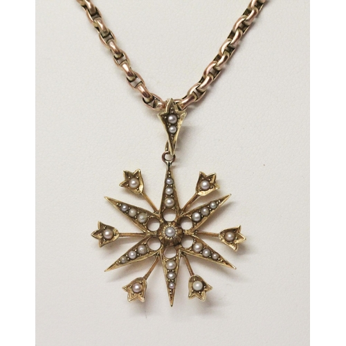 700 - Edwardian 15ct gold star pendant set with seed pearls suspended on a 9c barrel link chain. Pendant 4... 