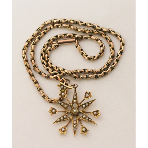 700 - Edwardian 15ct gold star pendant set with seed pearls suspended on a 9c barrel link chain. Pendant 4... 