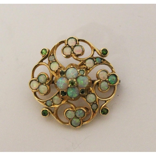 703 - An Edwardian opal and emerald brooch, in unmarked yellow gold. 26mm across. Gross weight 6 grams.