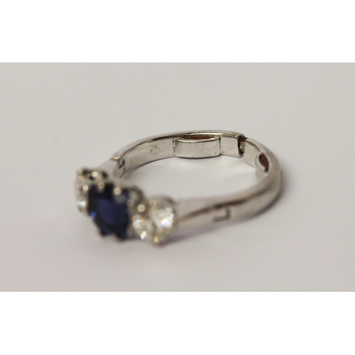 707 - A sapphire and diamond three stone ring, in unmarked platinum setting, with snap open hinged expandi... 