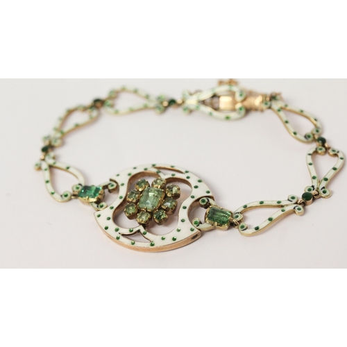 708 - A Victorian emerald and enamel bracelet, with a cluster of emeralds to the centre panel with further... 