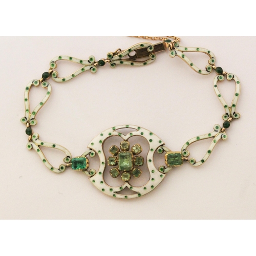 708 - A Victorian emerald and enamel bracelet, with a cluster of emeralds to the centre panel with further... 