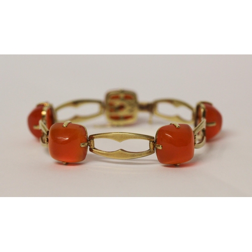 709 - A Victorian 15ct yellow gold carnelian bracelet, set with five domed cabochons on openwork gold link... 