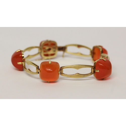 709 - A Victorian 15ct yellow gold carnelian bracelet, set with five domed cabochons on openwork gold link... 