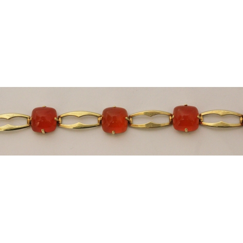 709 - A Victorian 15ct yellow gold carnelian bracelet, set with five domed cabochons on openwork gold link... 