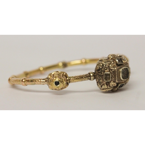 713 - Antique continental gold and gem set hinged bangle, with three raised box panels set with sapphire, ... 