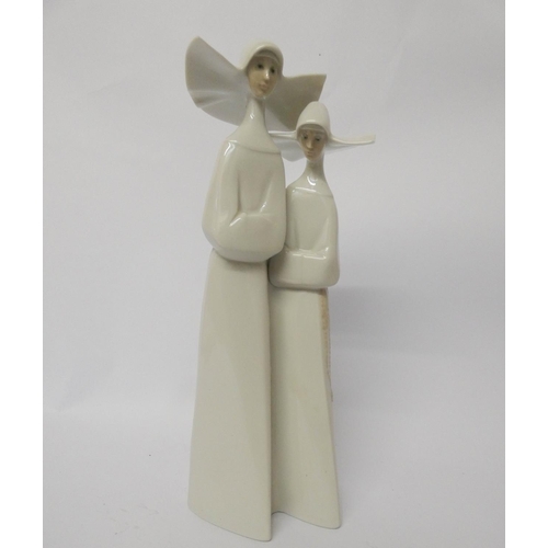 351 - Lladro - a pair of Nuns