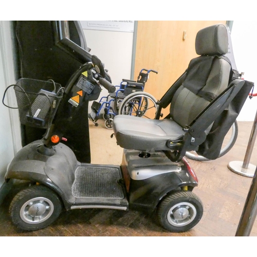 865 - A Shop Rider black and silver four wheel mobility scooter in working order with charger etc