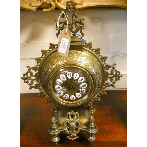 397 - French decorative brass mantel clock with circular dial and enamel roman numerals