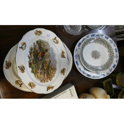 417 - Three oval pheasant decorated meat plates, and other meat plates