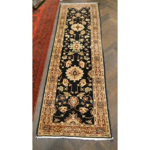 468 - Black and figured Persian design wool rug runner 96