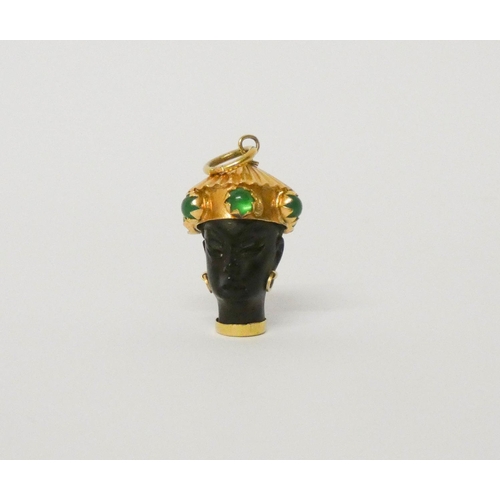 609 - A Blackamoor pendant, mounted in 18ct yellow gold with decorated with green cabochons. Gross weight ... 