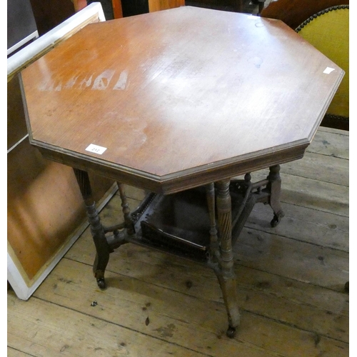 212 - An Edwardian octagonal walnut occasional table with under tier