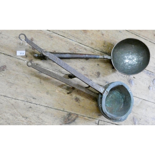 213 - A heavy copper serving bowl and three long handled melting pots