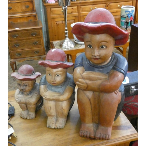 229 - Three painted carved wood graduated figures