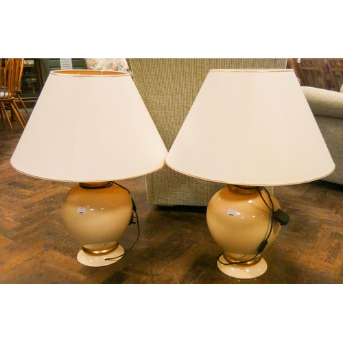 243A - Pair of large cream and gilt decorated vase shaped table lamps and shades