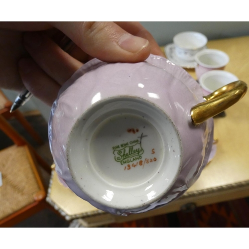 306 - A Shelley tea service comprising six cups and saucers, bread plate, slop bowl and six tea plates, th... 