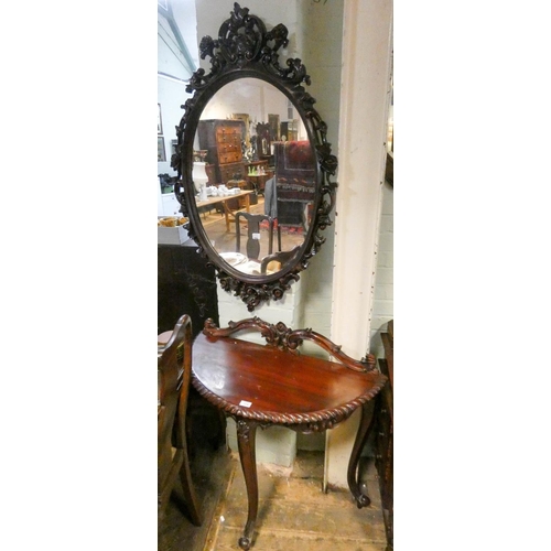 374 - Georgian style semi-circular carved mahogany console table and an over mirror in carved frame