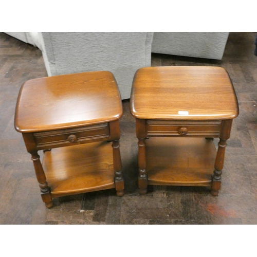 243 - A pair of Ercol Golden Dawn two tier bedside or lamp tables, each fitted one drawer