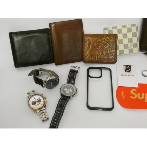 819 - A small collection of designer men's watches and wallets, Supreme dice etc all contained within a sm... 