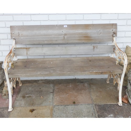 980 - A metal framed two seater garden bench seat with plank seat and back