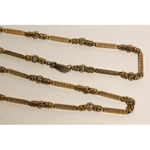 691 - Early 19th century long guard chain of fancy box links and granulated chain links, the clasp modelle... 