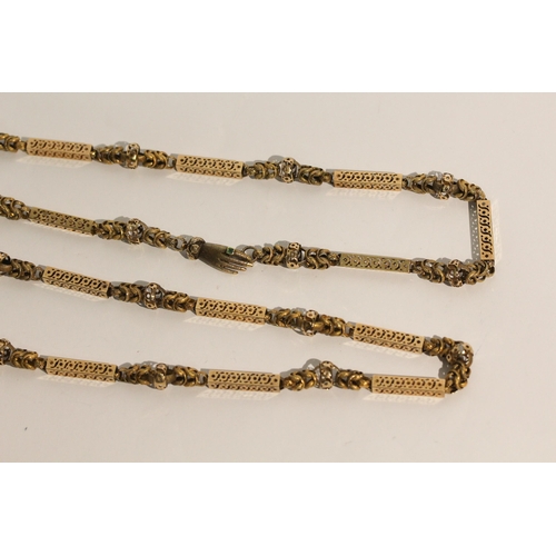 691 - Early 19th century long guard chain of fancy box links and granulated chain links, the clasp modelle... 