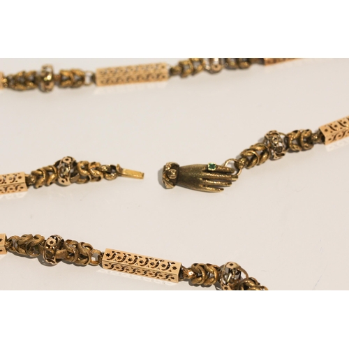 691 - Early 19th century long guard chain of fancy box links and granulated chain links, the clasp modelle... 