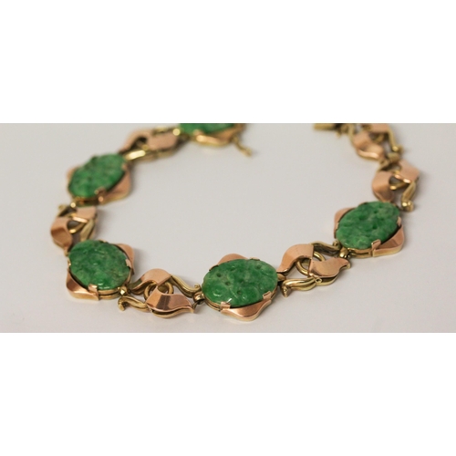 736 - A Chinese gold and carved jade panel bracelet, 18.5 cms long, Chinese character marks to clasp. Gros... 