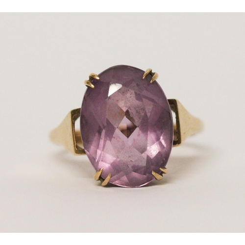 739 - An amethyst single stone ring, claw set with a large oval amethyst on hallmarked 9ct gold band. 5 gr... 