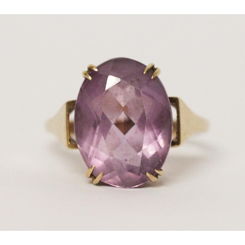 739 - An amethyst single stone ring, claw set with a large oval amethyst on hallmarked 9ct gold band. 5 gr... 