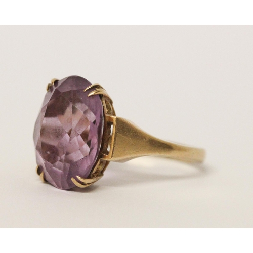 739 - An amethyst single stone ring, claw set with a large oval amethyst on hallmarked 9ct gold band. 5 gr... 