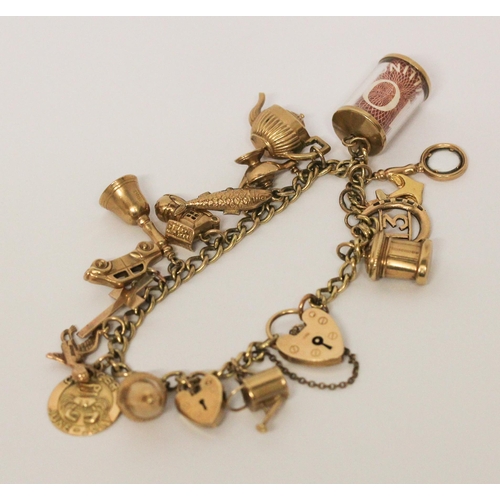 740 - A vintage 9ct yellow gold charm bracelet, set 17 charms including old £10 note, with hallmarked hear... 