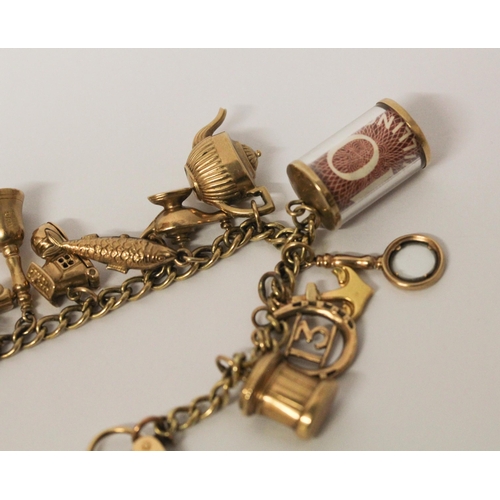 740 - A vintage 9ct yellow gold charm bracelet, set 17 charms including old £10 note, with hallmarked hear... 