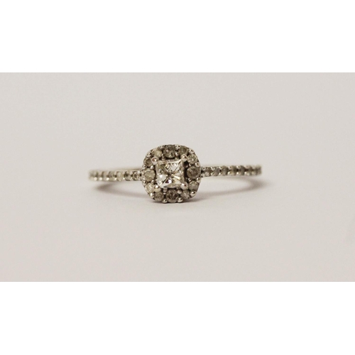 571 - A modern diamond cluster ring, on diamond set shoulders in 9ct white gold. Hallmarked, ring size M