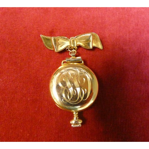 569 - Edwardian ladies fob watch or nurses watch by Waltham, gold plated on plated ribbon bow brooch faste... 