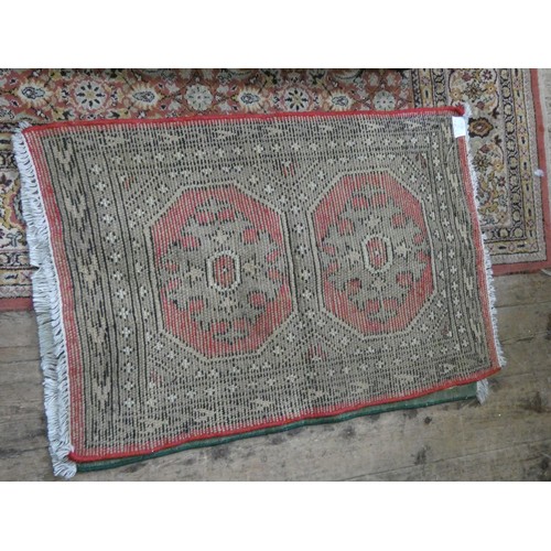 149 - A red and patterned Afghan style wool pile rug and a striped wool pile rug