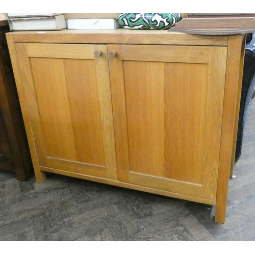 112 - A light oak two door sideboard, 3'3 wide