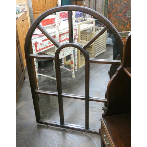 115 - A mahogany framed rounded top window style wall mirror