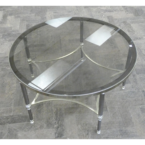 116 - A Hollywood Regency circular glass top coffee table on black and brass base, 2'6 diameter