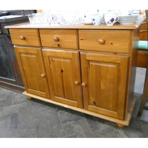 145 - A modern pine sideboard fitted three drawers and cupboards, 3'9 wide