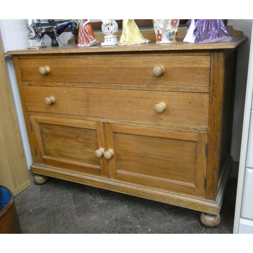 15 - A light oak bedroom chest fitted two drawers with cupboards under, 3'6 wide