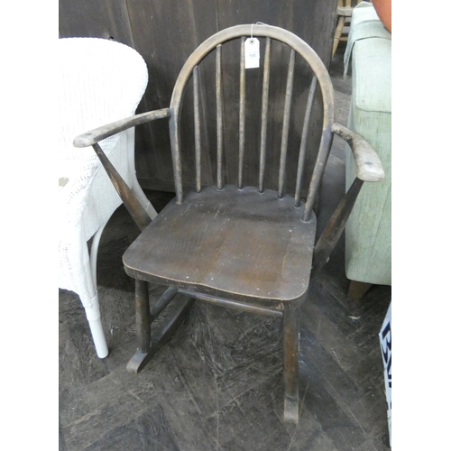 155 - An old Ercol stick back rocking elbow chair