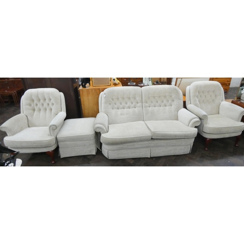 161 - A two seater settee three piece lounge suite in buttoned cream material with loose cushions and matc... 