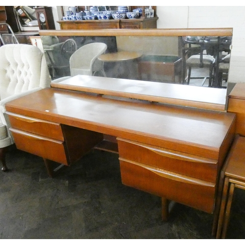 163 - A 1970's/80's long teak kneehole dressing table with long mirror, 5'6 wide