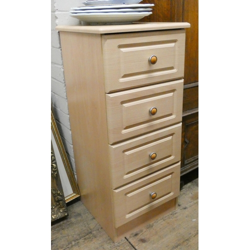 193 - A narrow modern light wood chest of four drawers, 16