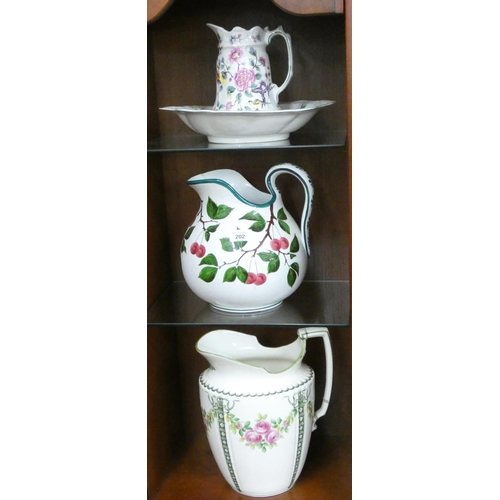 202 - A Wemyss jug (cracked), small toilet jug and bowl and another toilet jug