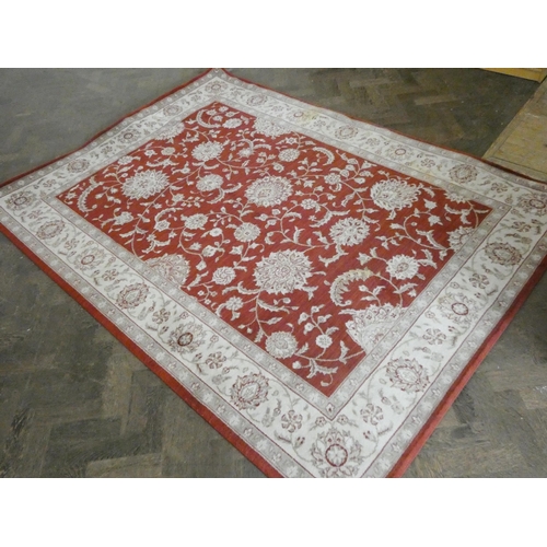 240 - A pair of large red and fawn pattern rugs each 7'6 X 5'6 approximately