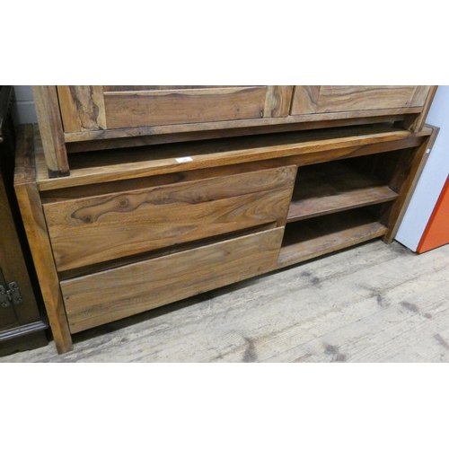 28 - An Indonesian hardwood  television cabinet, fitted two drawers and shelves, matching the previous lo... 