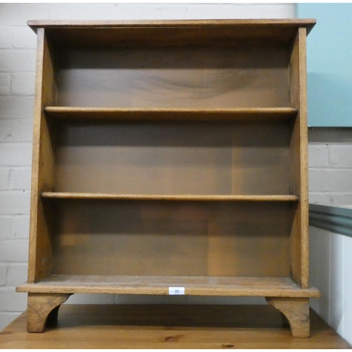 35 - A small light oak open bookcase, 2'6 wide